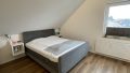 Schlafzimmer im ausgebauten Dachboden