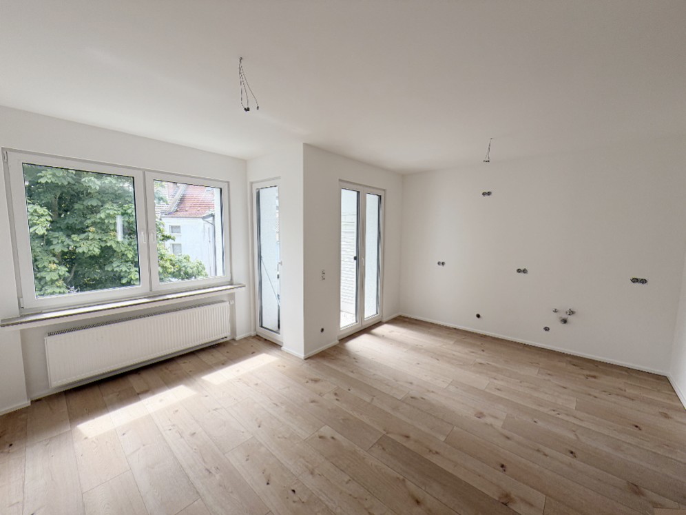 Wohnzimmer mit offener Küche